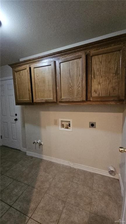 laundry area with washer hookup, electric dryer hookup, cabinets, tile patterned floors, and gas dryer hookup