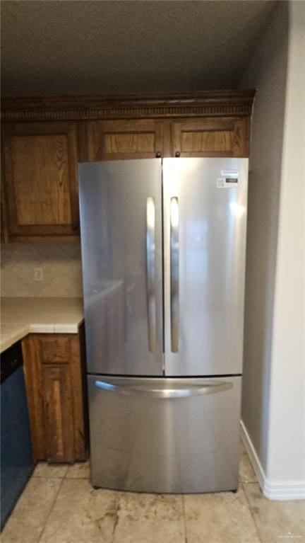 kitchen featuring stainless steel fridge and dishwasher