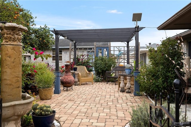 view of patio featuring a pergola