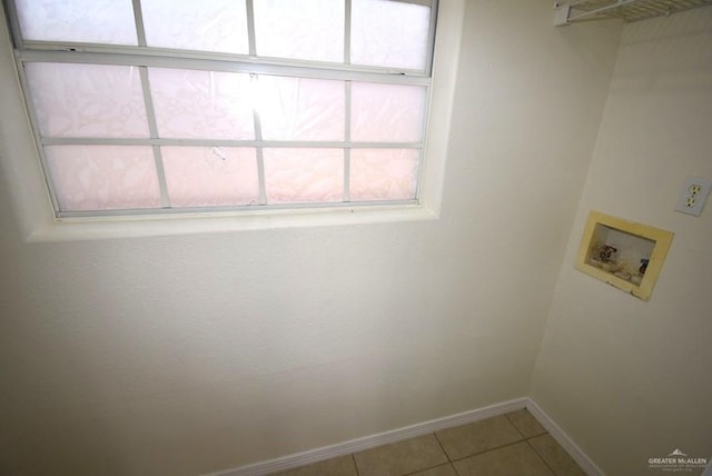 202 E Cardinal Ave, Pharr, TX 78577 - washroom with washer hookup, healthy amount of natural light, baseboards, and light tile patterned flooring