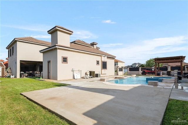 rear view of property featuring a patio, cooling unit, and a lawn