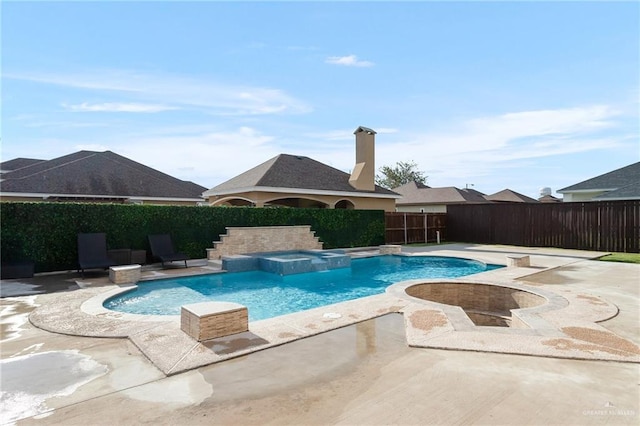 view of swimming pool featuring an in ground hot tub and a patio