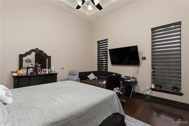 bedroom with ceiling fan and hardwood / wood-style flooring