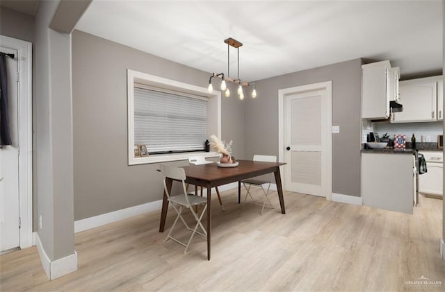 dining area with light hardwood / wood-style floors