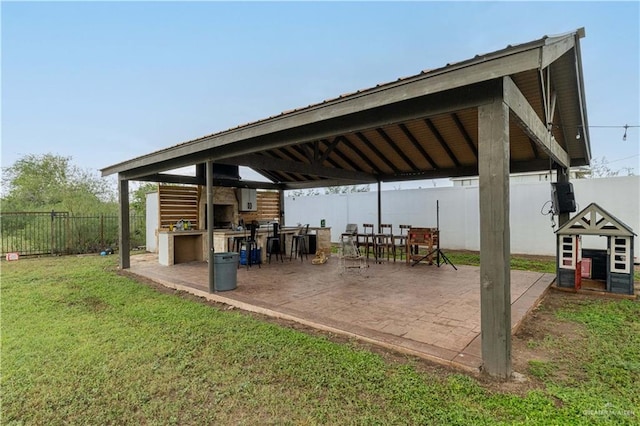 view of patio featuring a gazebo and exterior kitchen