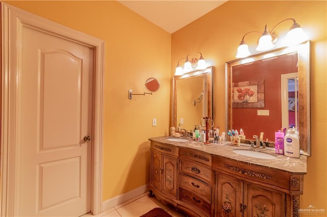 bathroom featuring tile patterned flooring and vanity