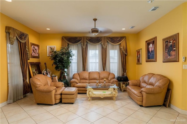 living room with light tile patterned floors and ceiling fan