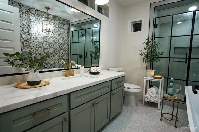 420 N Mayberry Rd, Alton, TX 78573 - full bath with vanity, a shower stall, a chandelier, a freestanding tub, and tile patterned flooring