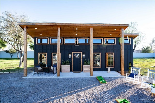 420 N Mayberry Rd, Alton, TX 78573 - rear view of house featuring board and batten siding