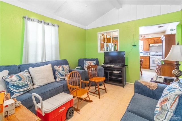 living room featuring vaulted ceiling with beams, light floors, and visible vents