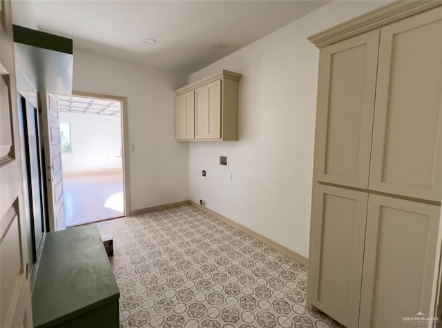 clothes washing area with hookup for a washing machine and cabinets