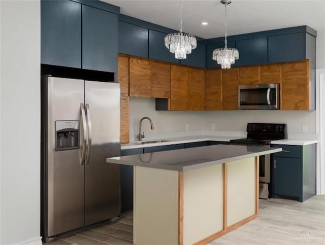 kitchen featuring stainless steel appliances, a kitchen island, a sink, light wood-type flooring, and pendant lighting