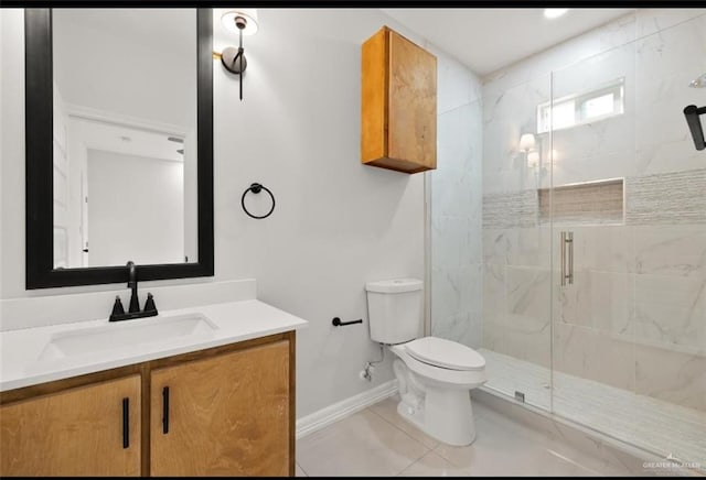 full bathroom with a marble finish shower, toilet, vanity, tile patterned flooring, and baseboards