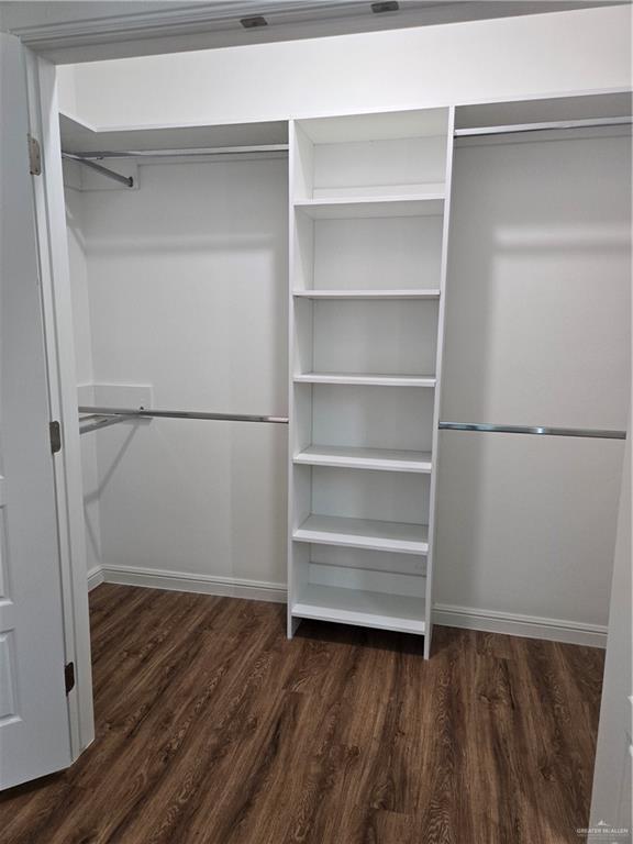 901 E Yuma Ave Unit 206, Mcallen, TX 78503 - spacious closet featuring wood finished floors