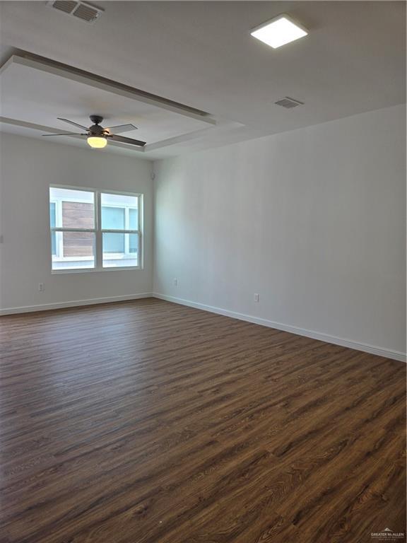 901 E Yuma Ave Unit 206, Mcallen, TX 78503 - empty room with dark wood-type flooring, baseboards, ceiling fan, and visible vents