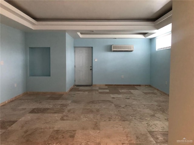 unfurnished room with a wall mounted air conditioner