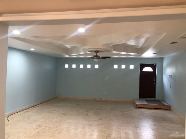 foyer entrance featuring ceiling fan