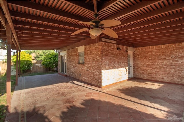 view of patio with a ceiling fan and fence