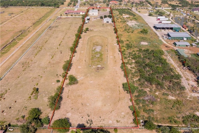 birds eye view of property featuring a rural view