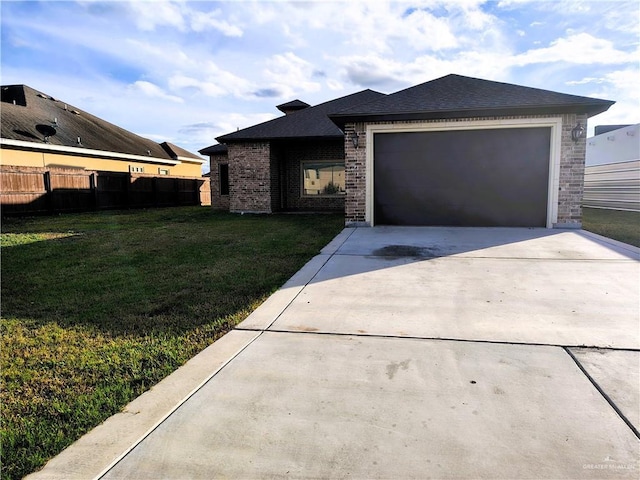 view of front of property with a garage and a front yard