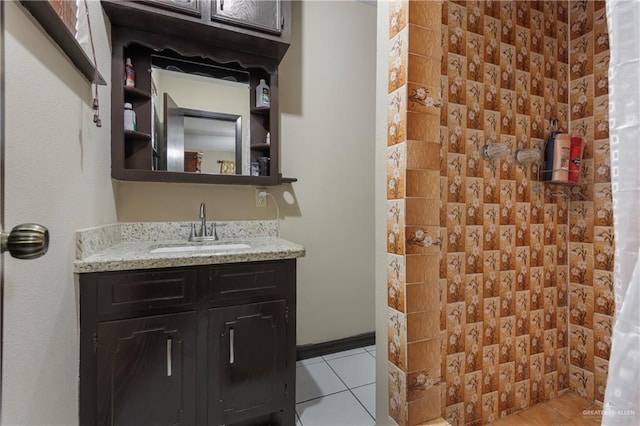 bathroom featuring vanity, tile patterned floors, and curtained shower