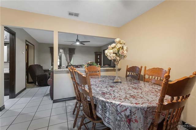 dining space featuring ceiling fan and light tile patterned flooring