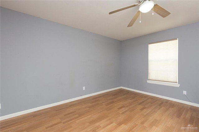 empty room with light wood-type flooring and ceiling fan