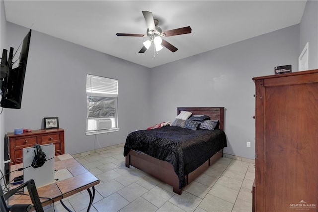 bedroom with ceiling fan and cooling unit