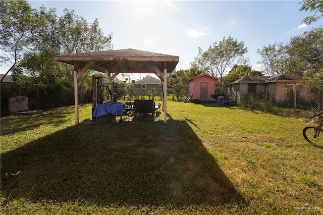 view of yard featuring a gazebo and a shed