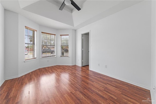 4217 W Ithaca Ave, Mcallen, TX 78501 - empty room featuring a ceiling fan, wood finished floors, a raised ceiling, and baseboards