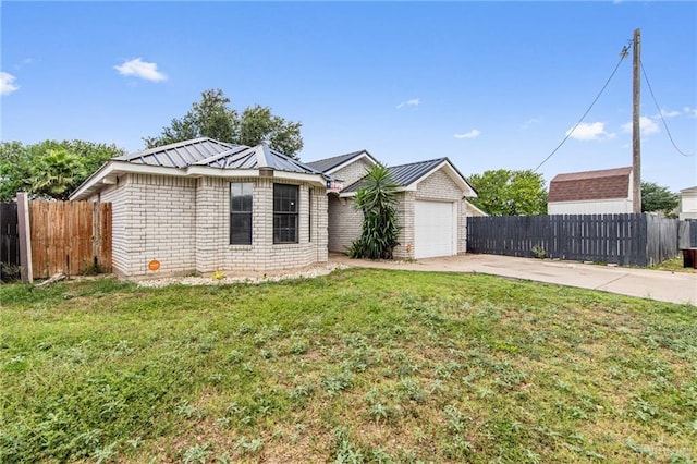 4217 W Ithaca Ave, Mcallen, TX 78501 - ranch-style house with driveway, a garage, and metal roof
