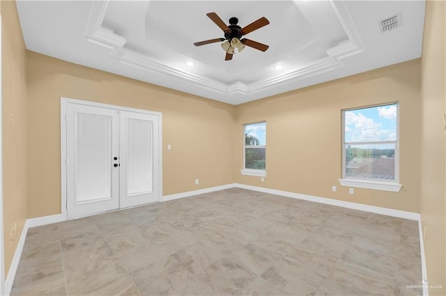 unfurnished bedroom with ceiling fan, a raised ceiling, and a closet