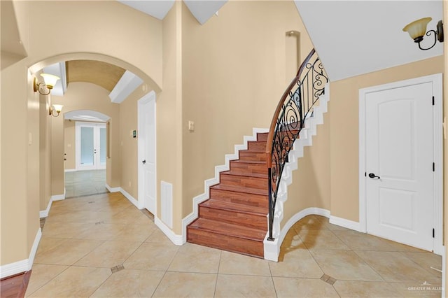 foyer entrance featuring light tile patterned floors