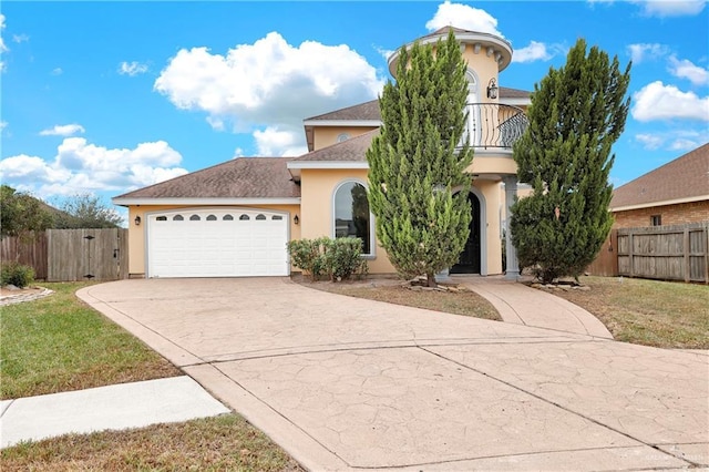 view of front of house with a balcony, a garage, and a front lawn