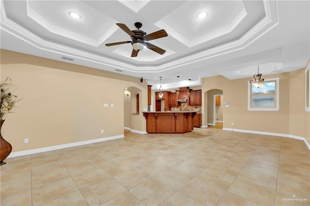 3218 Lerma Dr, Edinburg, TX 78539 - unfurnished living room featuring arched walkways, a raised ceiling, a ceiling fan, coffered ceiling, and light tile patterned floors