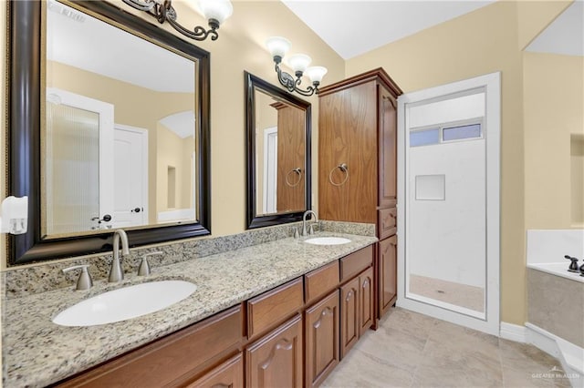 3218 Lerma Dr, Edinburg, TX 78539 - full bathroom featuring a bath, double vanity, a stall shower, and tile patterned flooring