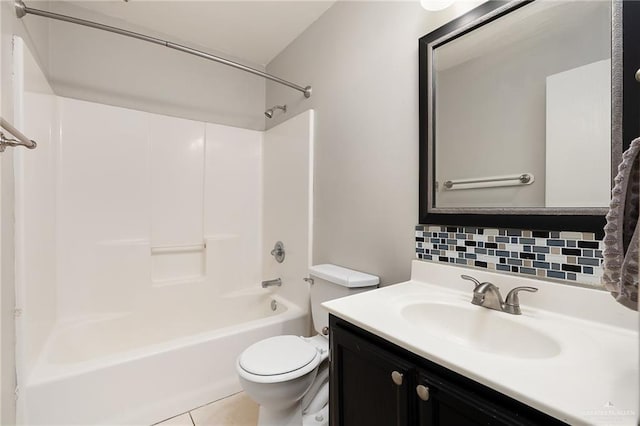 full bathroom featuring vanity, tile patterned flooring, toilet, tasteful backsplash, and tub / shower combination