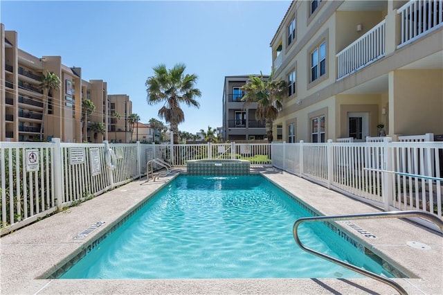 view of pool featuring a hot tub