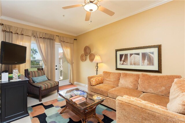 living room featuring ceiling fan and ornamental molding