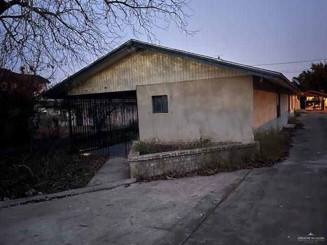 view of property exterior at dusk