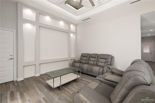 living room featuring visible vents and wood finish floors