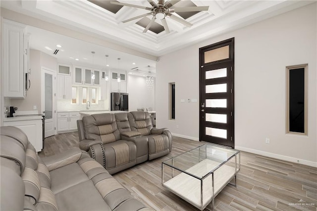 living area featuring coffered ceiling, recessed lighting, light wood-style floors, baseboards, and ceiling fan