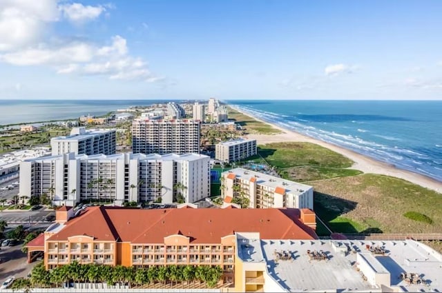 bird's eye view featuring a water view, a view of city, and a view of the beach