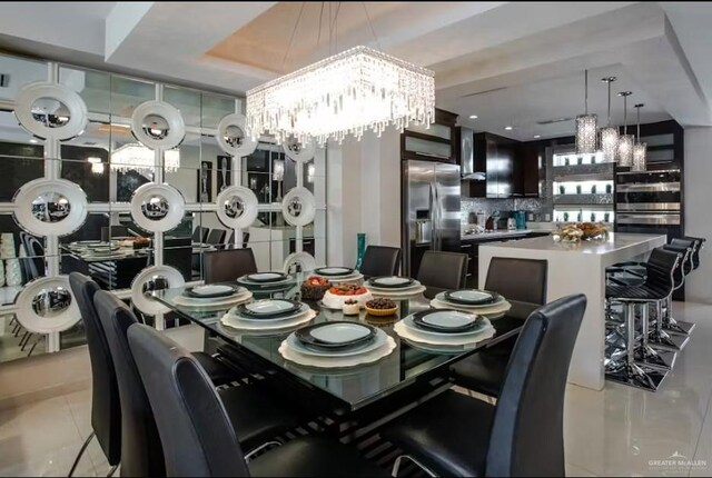 dining room with a chandelier and light tile patterned floors