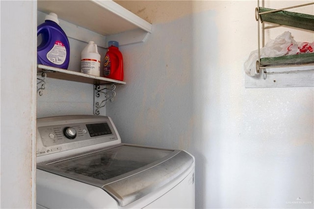 clothes washing area featuring laundry area and washer / dryer