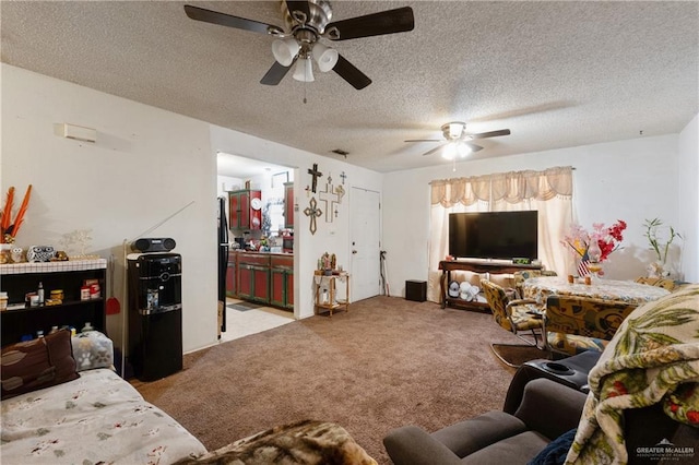 living room featuring carpet floors, a textured ceiling, and ceiling fan