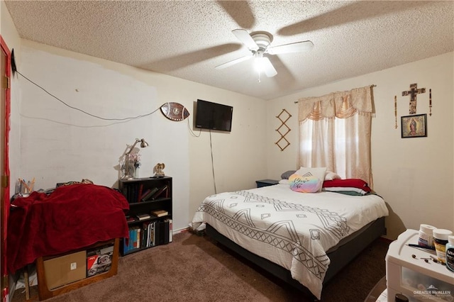 carpeted bedroom with a ceiling fan and a textured ceiling