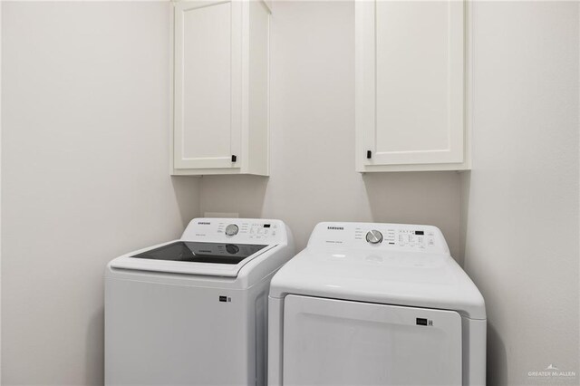 3312 Saturn St, Edinburg, TX 78542 - laundry area with cabinet space and washing machine and clothes dryer