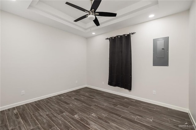 3312 Saturn St, Edinburg, TX 78542 - unfurnished room featuring electric panel, dark wood-style flooring, a raised ceiling, a ceiling fan, and recessed lighting