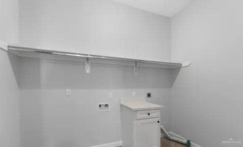 laundry room with laundry area, baseboards, washer hookup, and electric dryer hookup